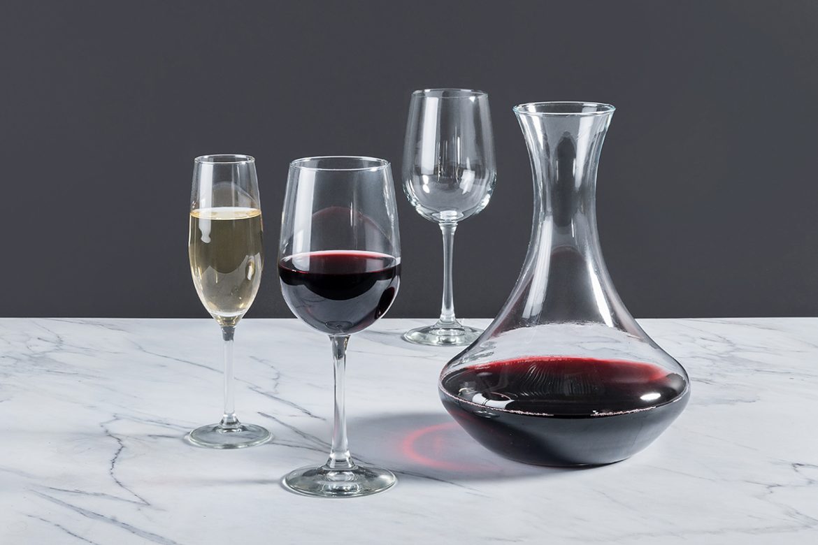 Wine,Glasses,Of,Varying,Sizes,And,A,Decanter,Filled,With